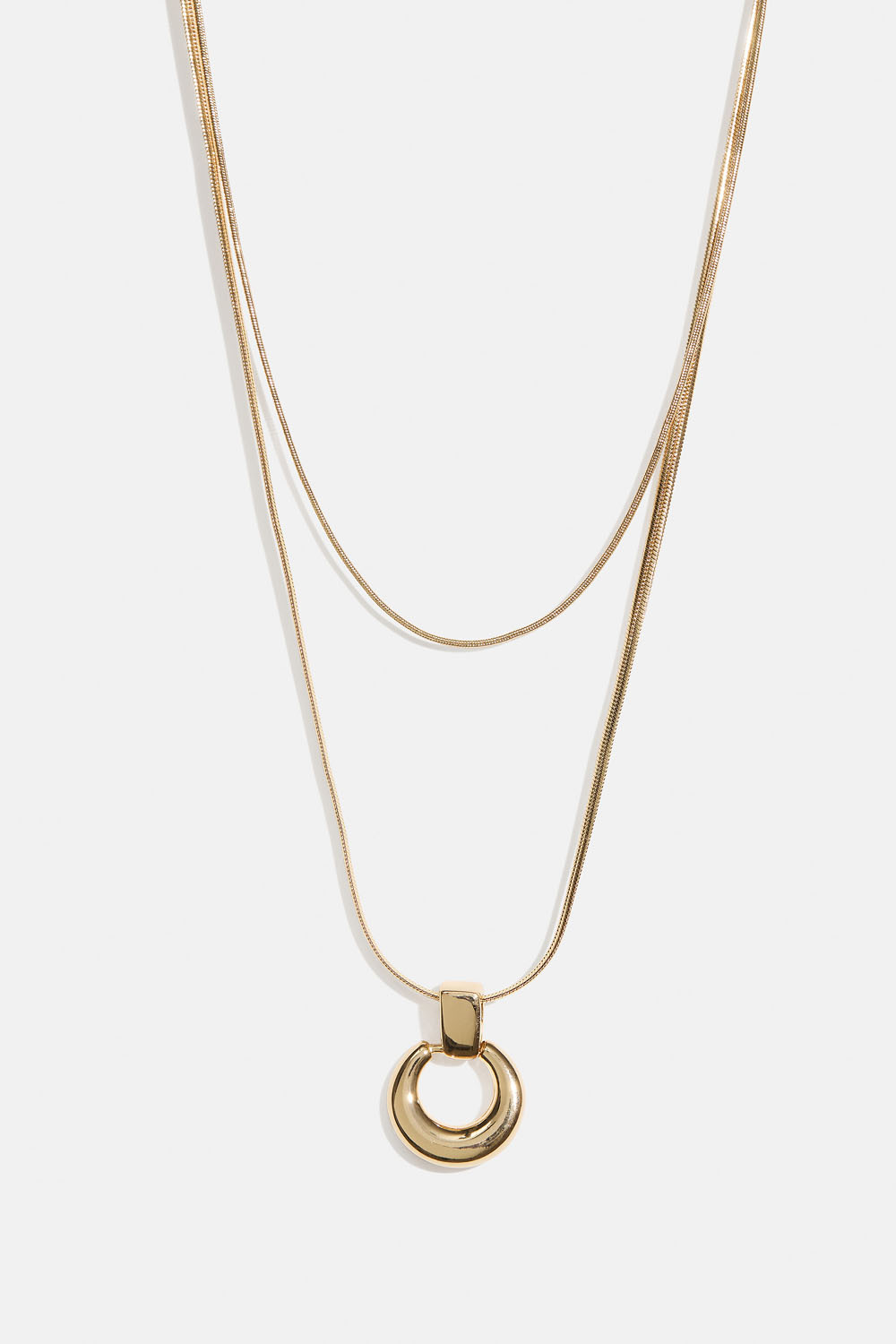 Guldfärgat dubbelhalsband med runt hänge