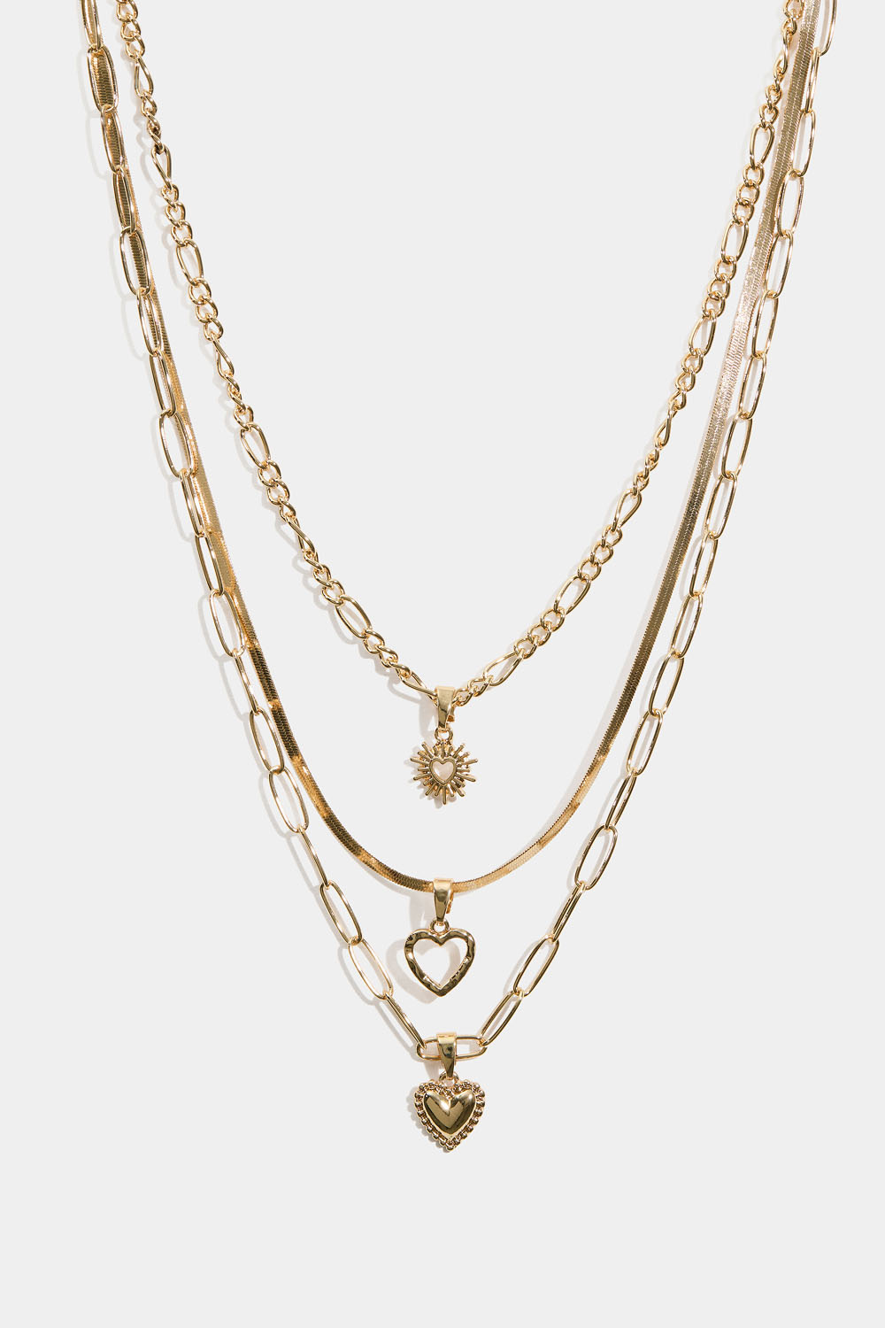 Guldfärgat trippelhalsband med hängsmycken