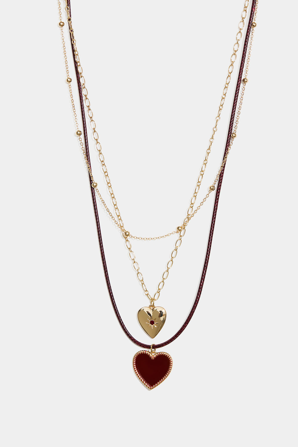 Guldfärgat trippelhalsband med hjärtan och snöre