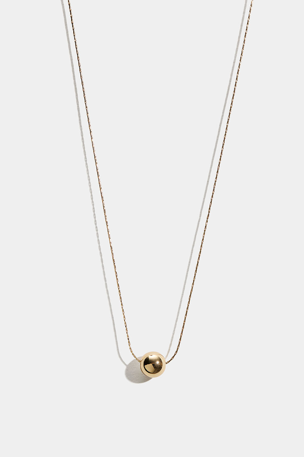 Halsband med rund kedja och guldig pärla