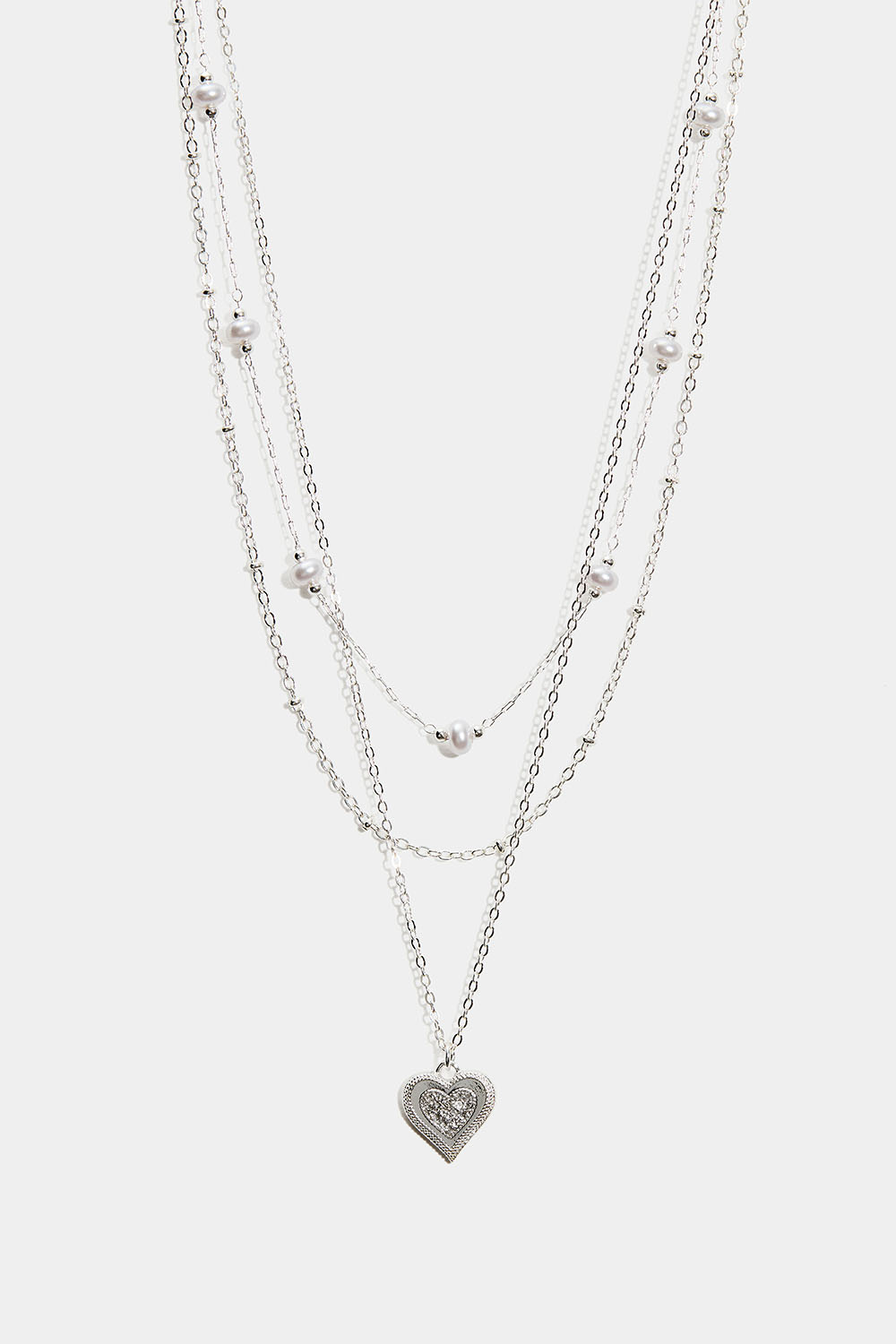 Lager-på-lager halsband med pärlor och hjärtformad berlock