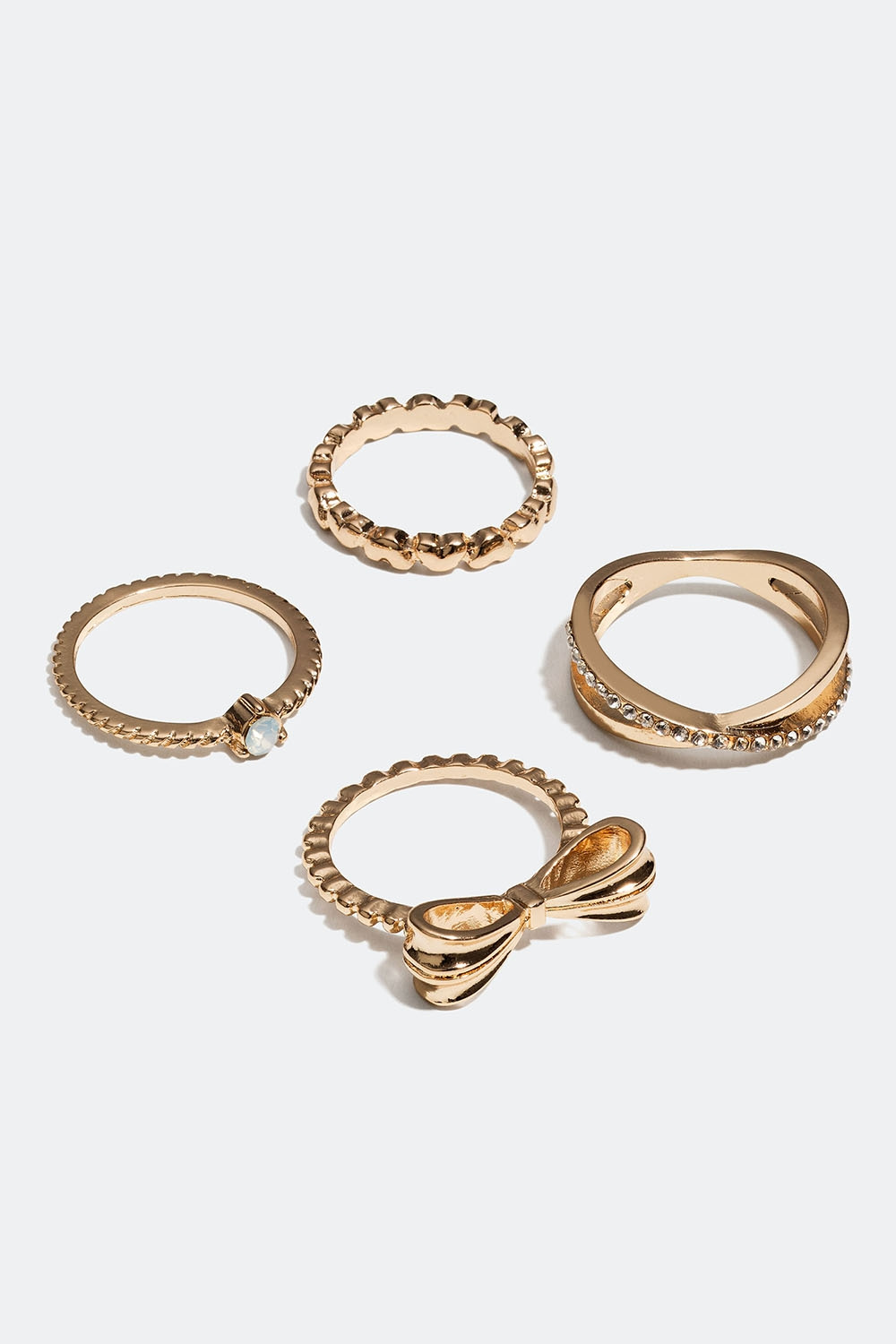 Guldfärgade ringar med rosett, hjärtan och glasstenar, 4-pack
