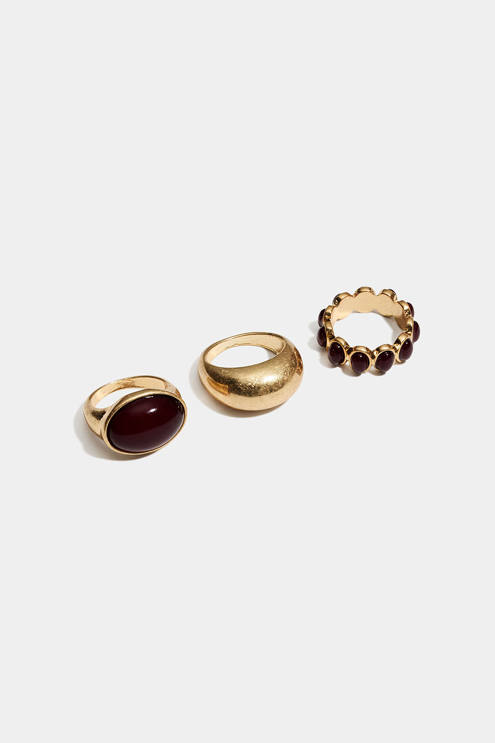 Guldfärgade ringar med vinröda pärlor, 3-pack
