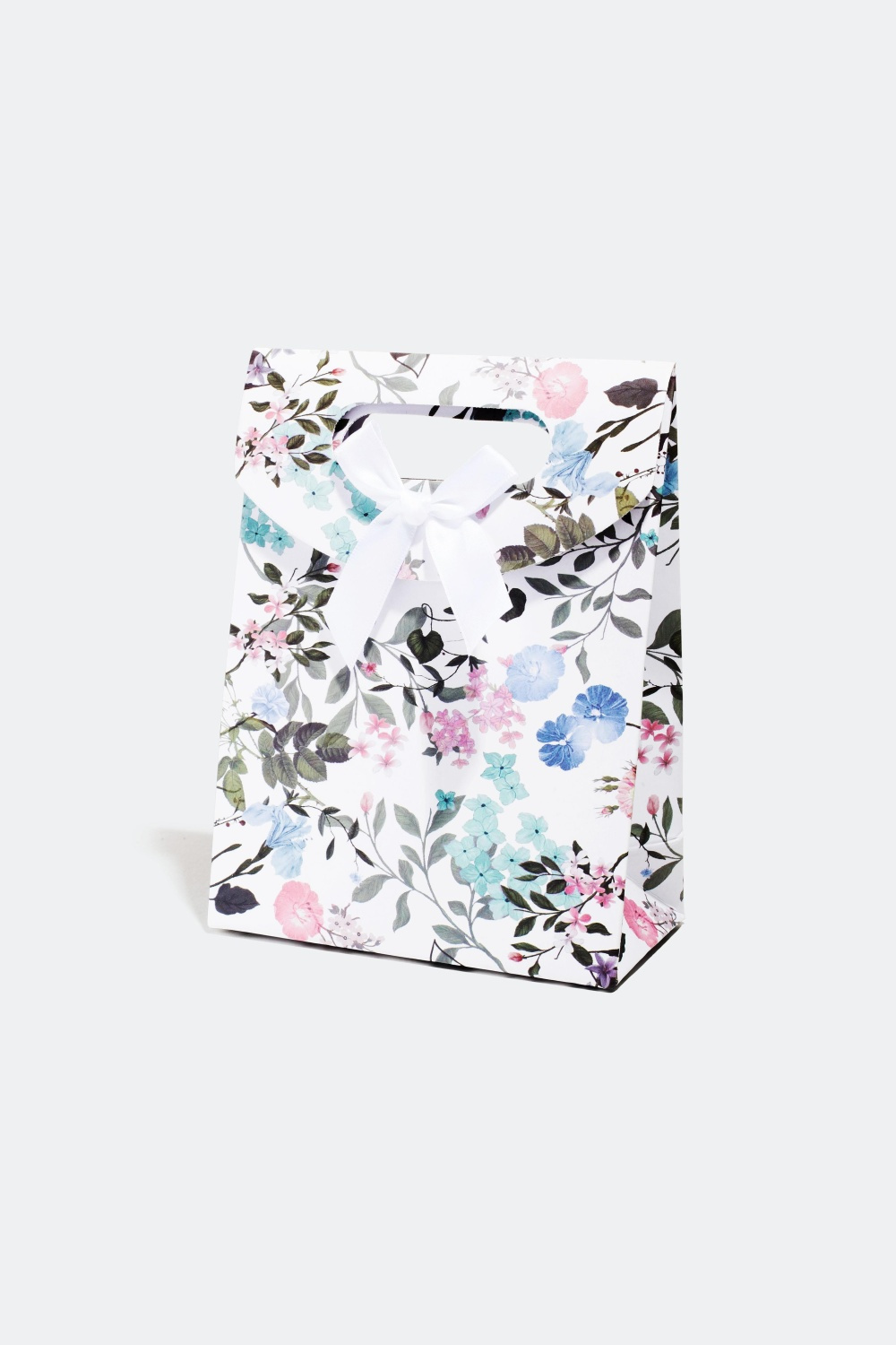 Presentpåse i blommönster med rosett