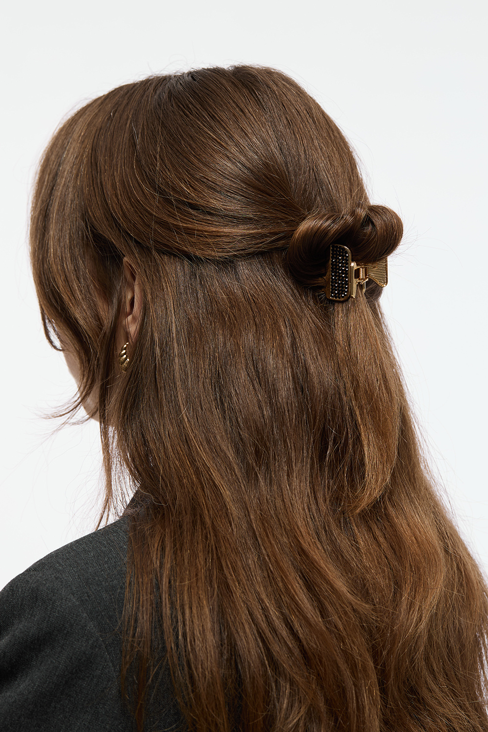 Guldfärgad hårklämma med svart strass