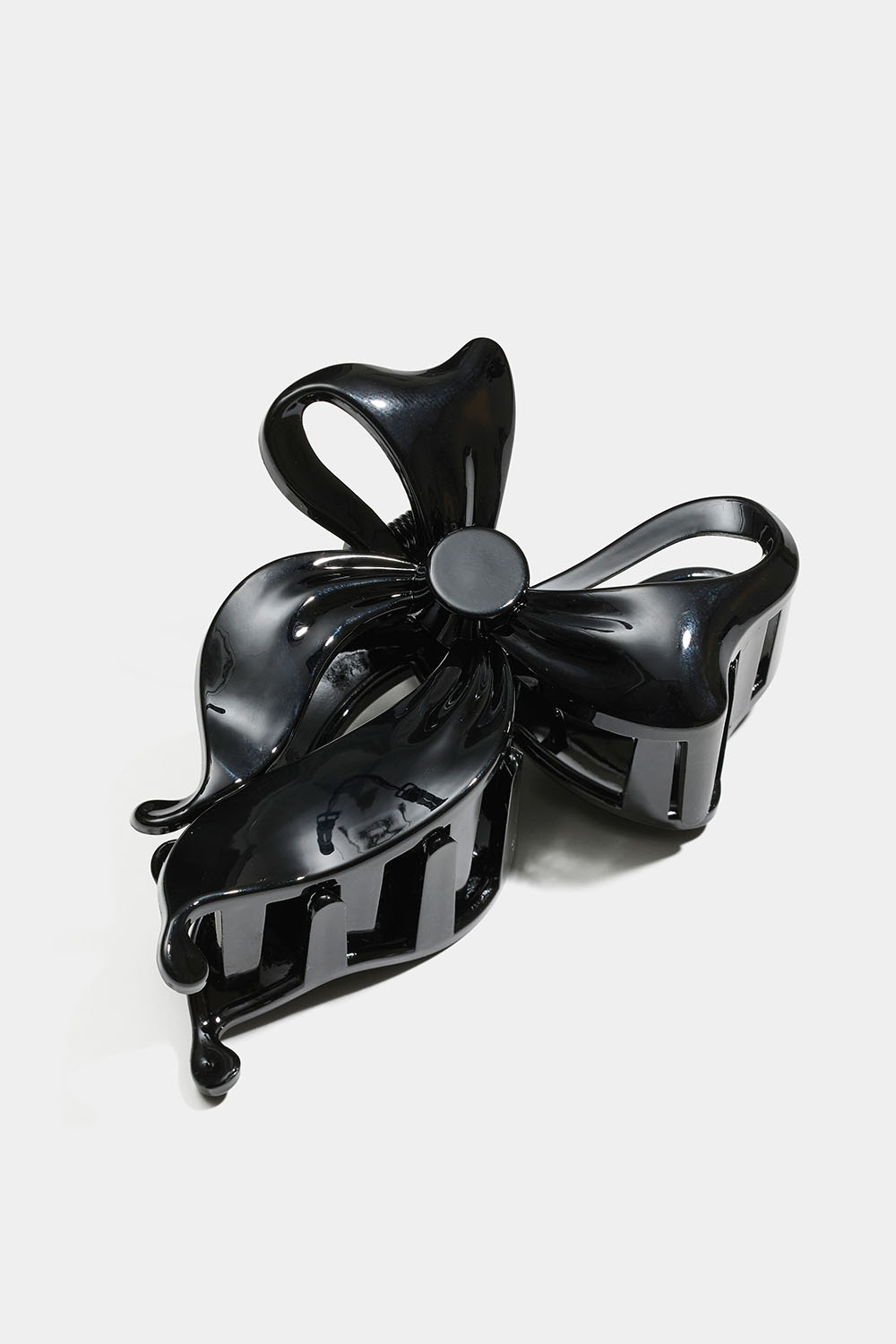 Svart rosettformad hårklämma