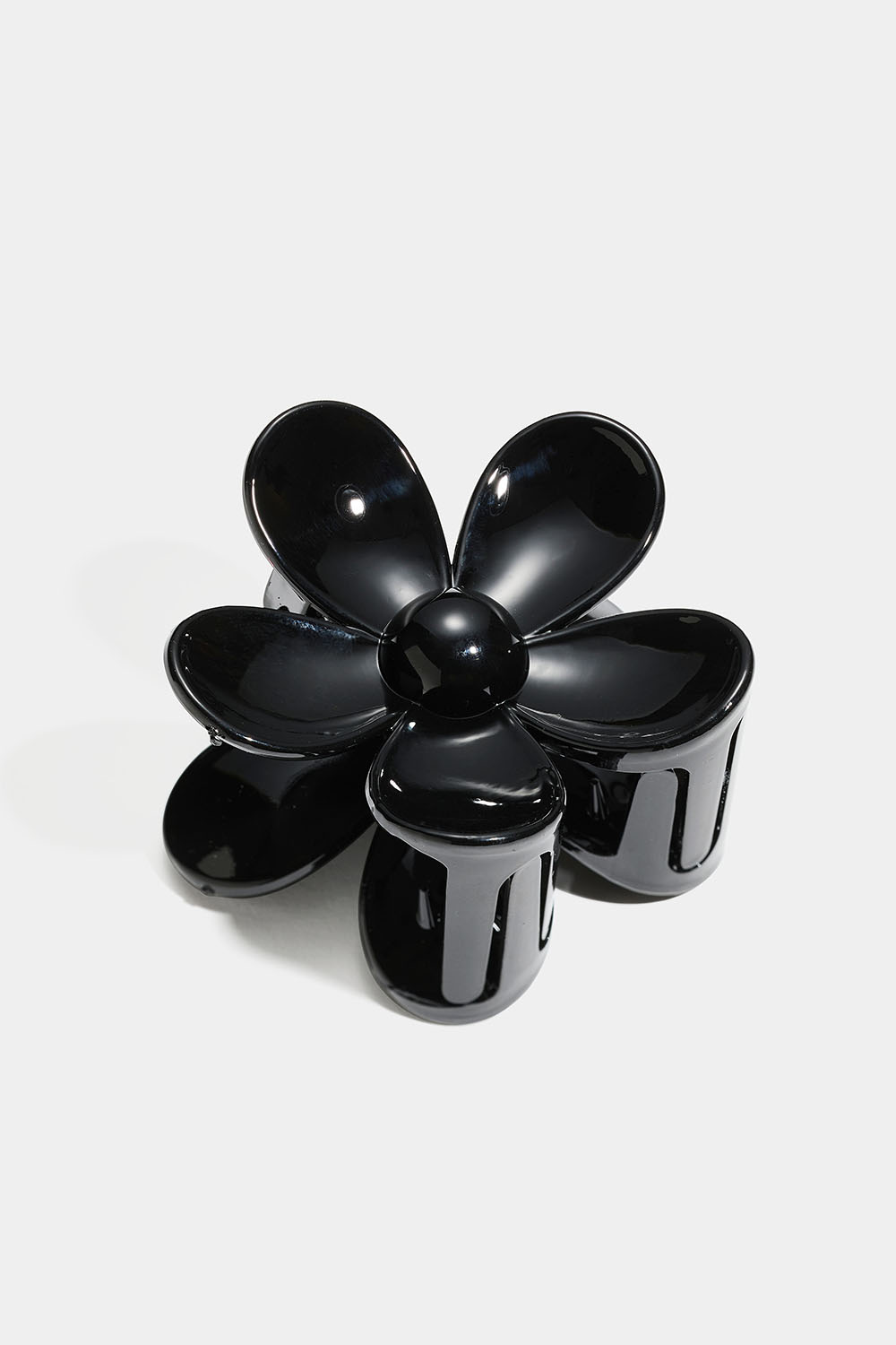 Svart blomformad hårklämma