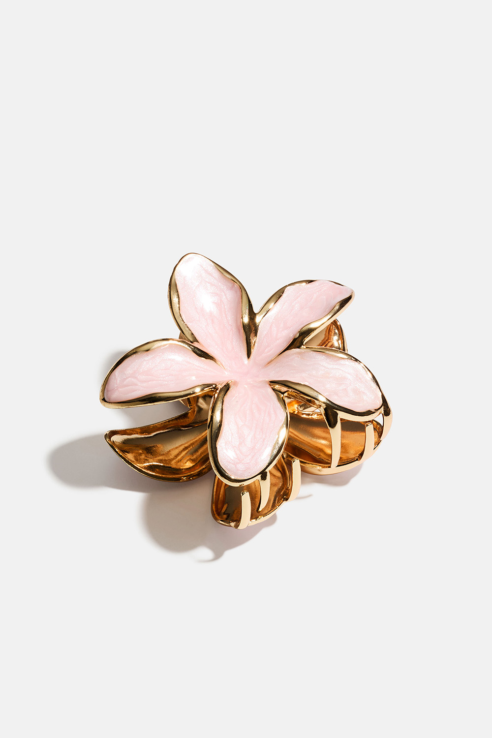 Rosa blomformad hårklämma i guldfärgad metall