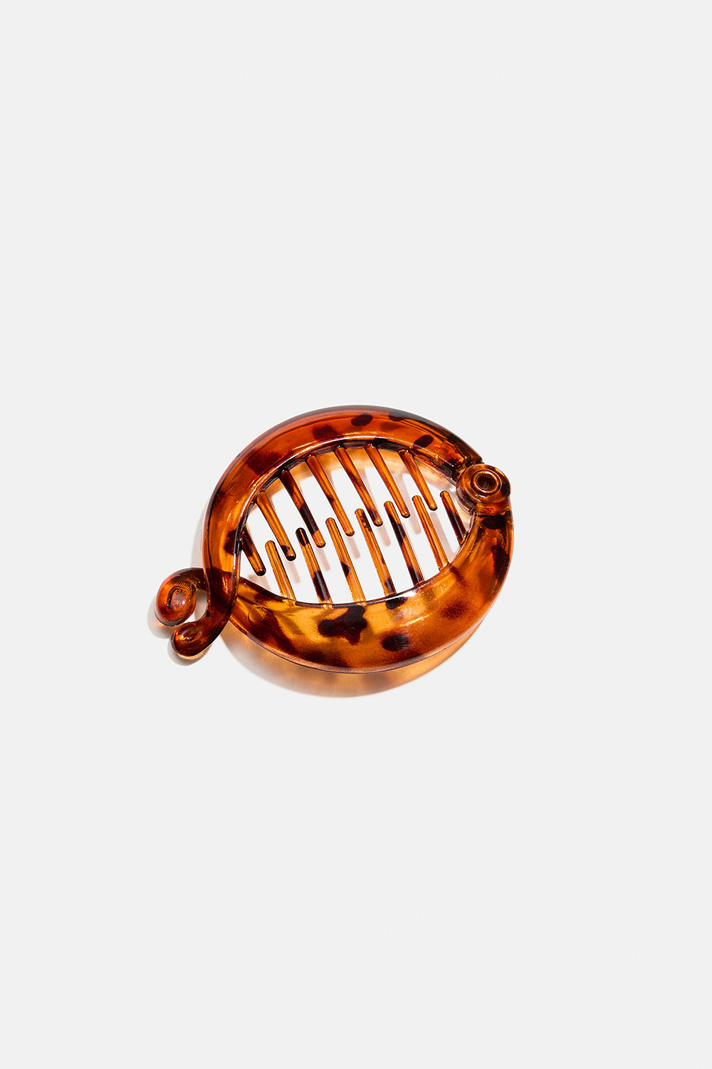 Liten tortoisemönstrad rund bananklämma