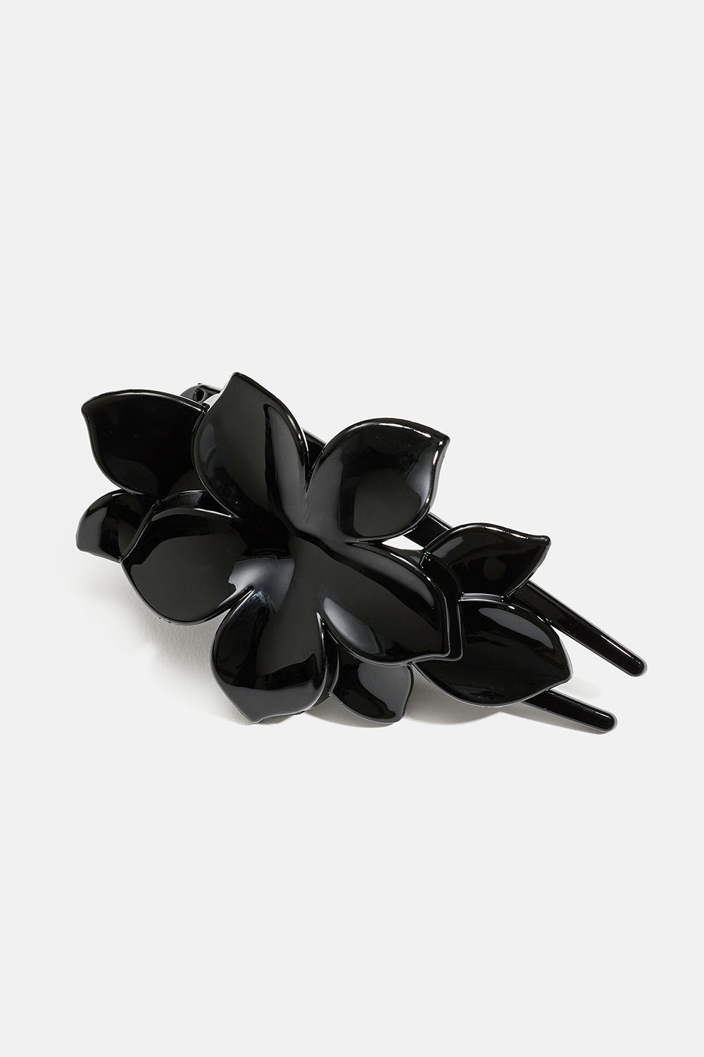 Svart hårklämma med blomma