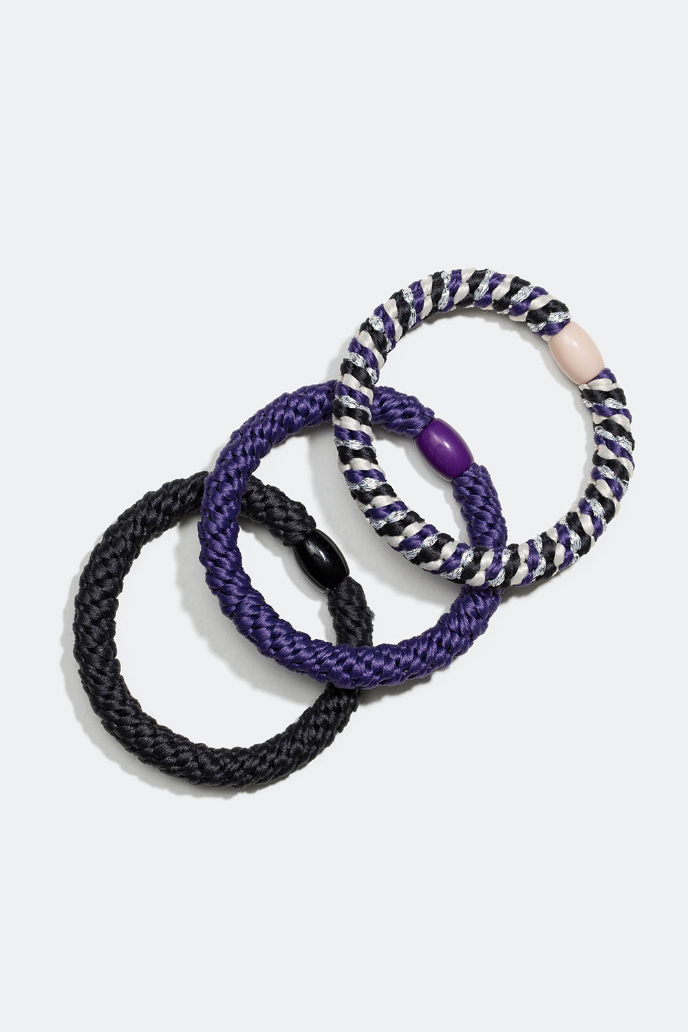 Flätade hårsnoddar i mix av lila och svart, 3-pack