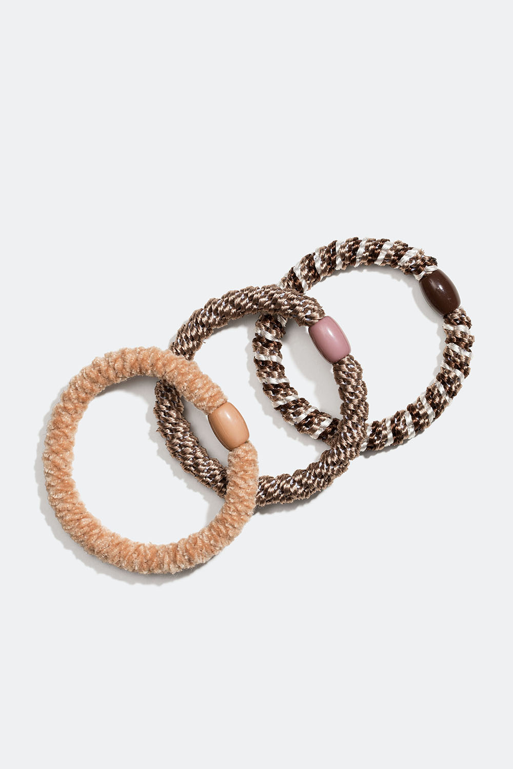 Mix av flätade hårsnoddar i beige och brunt färg, 3-pack