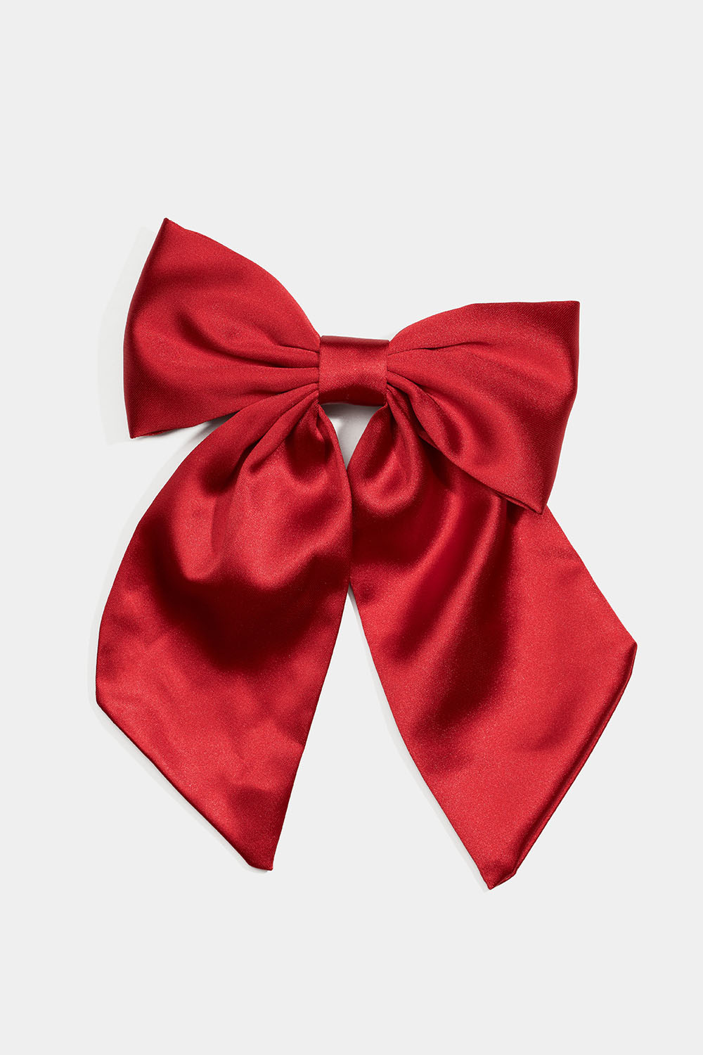 Hårspänne med röd rosett i sidenimitation