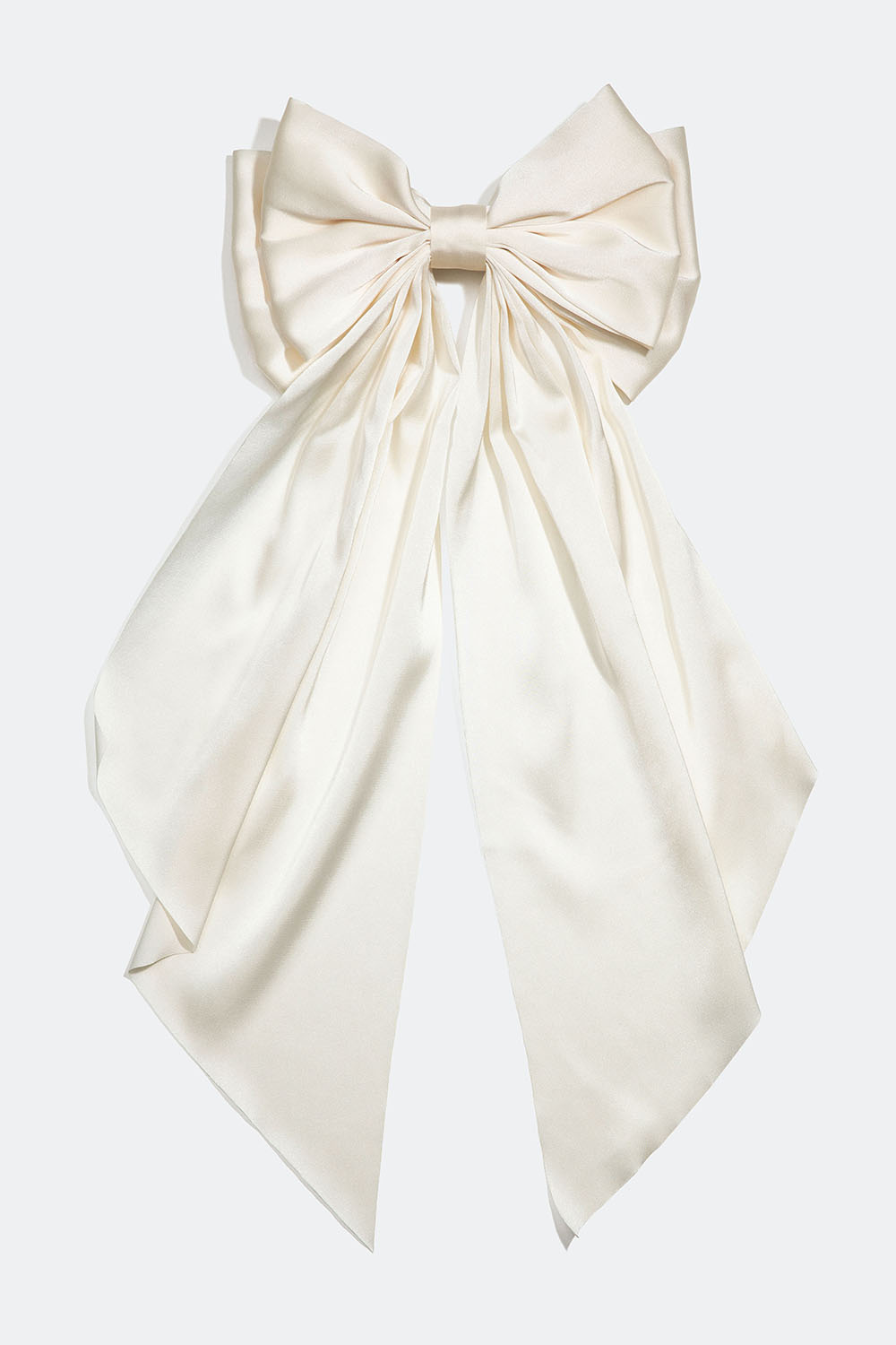 Hårspänne med stor vit rosett i sidenimitation