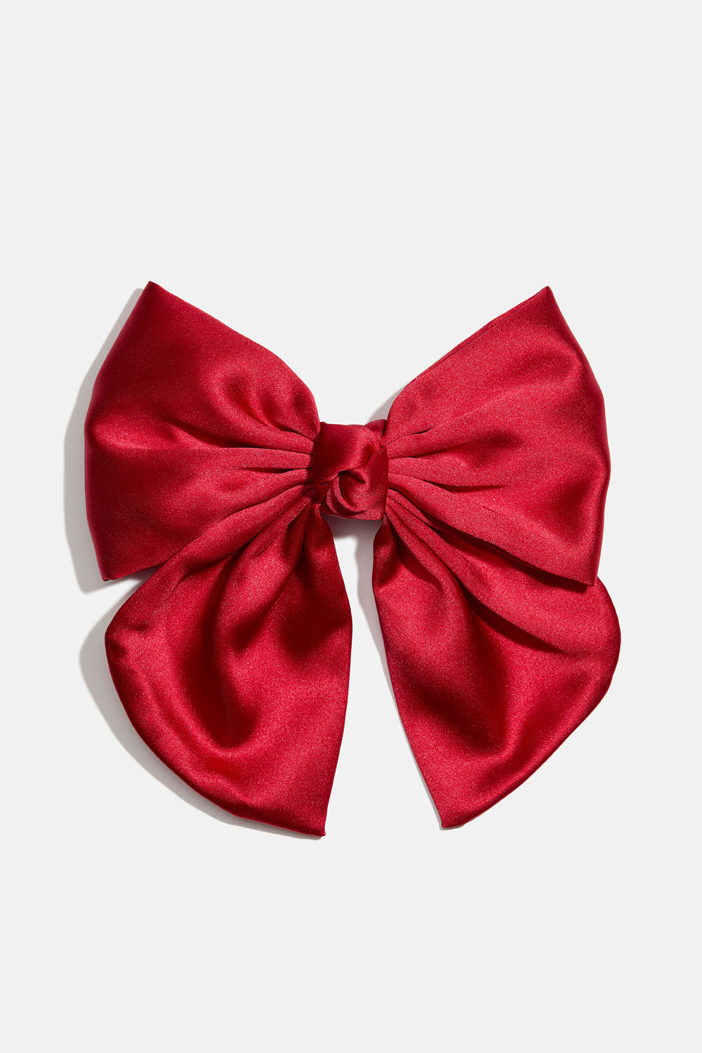 Hårspänne med röd rosett och knut