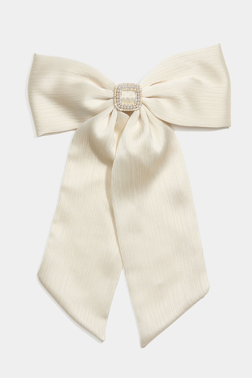 Hårspänne med vit rosett och strassdekoration