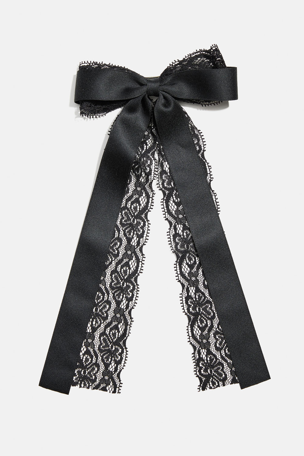 Hårspänne med rosett i band och spets