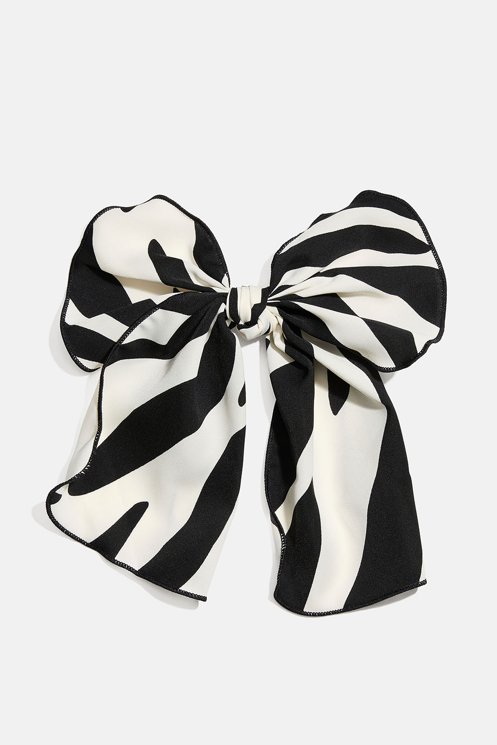 Hårspänne med rosett i zebramönstrat tyg