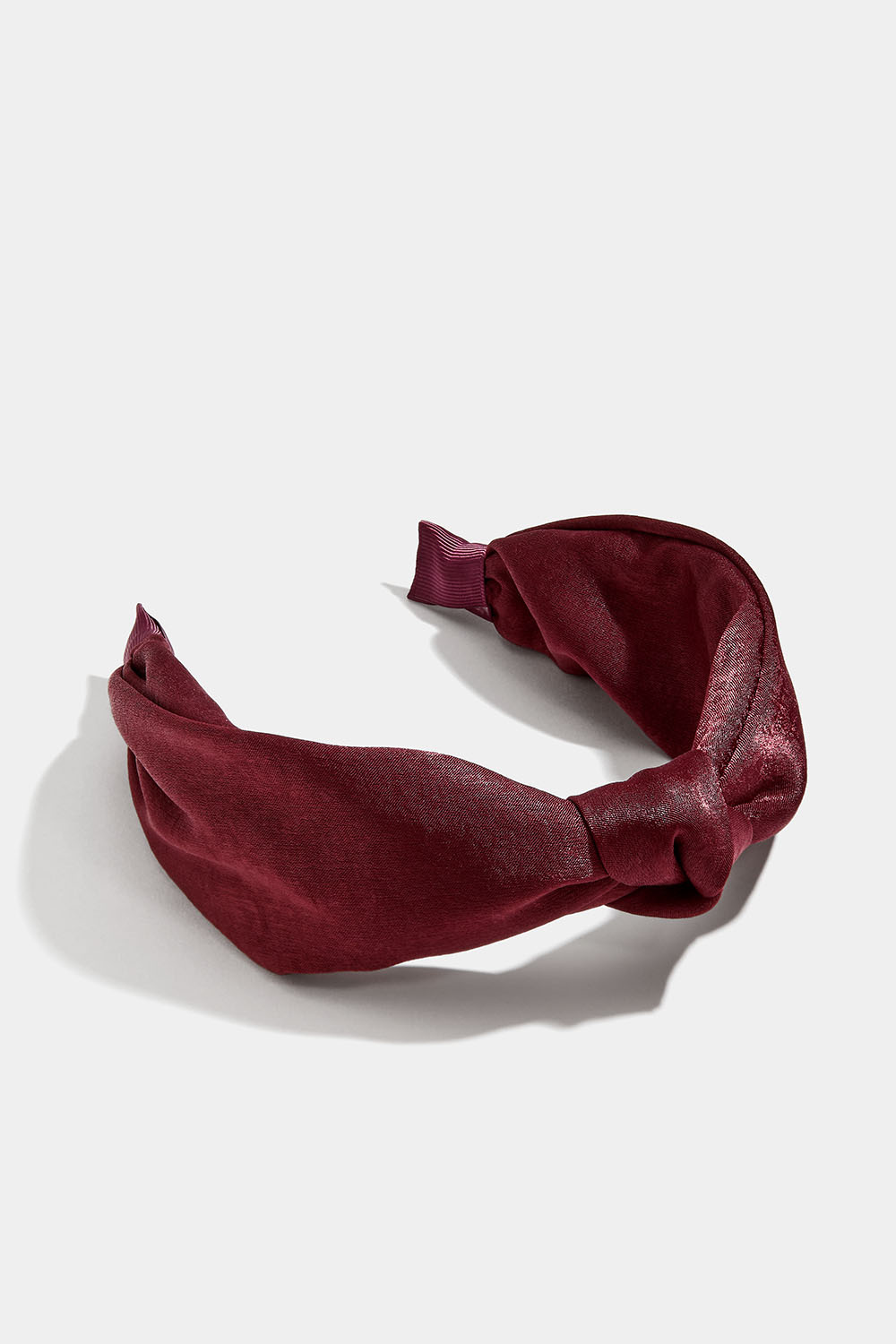 Vinrött diadem med knut