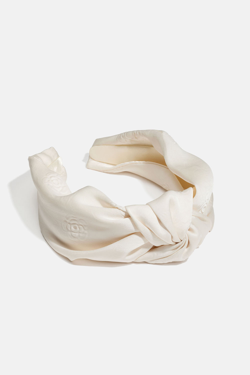 Vitt diadem med knut och rosmönster