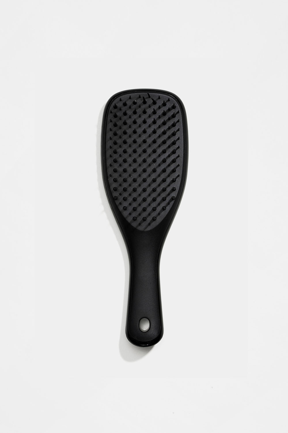 Liten svart hårborste detangler