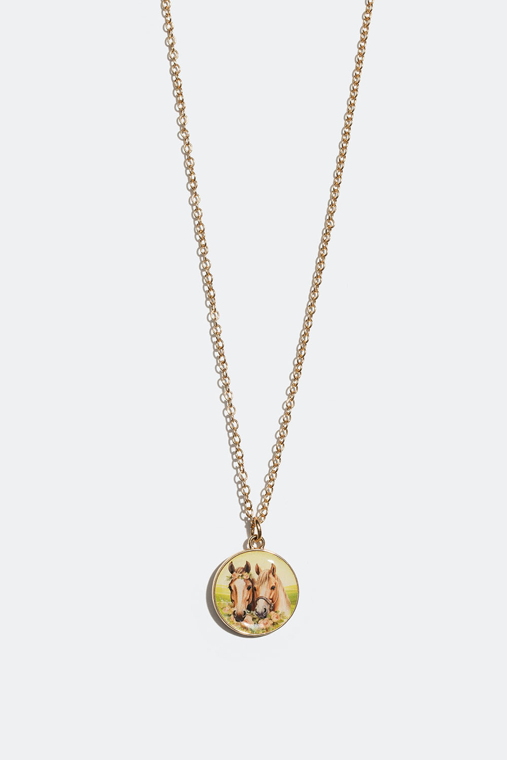 Halsband med runt hänge med hästar