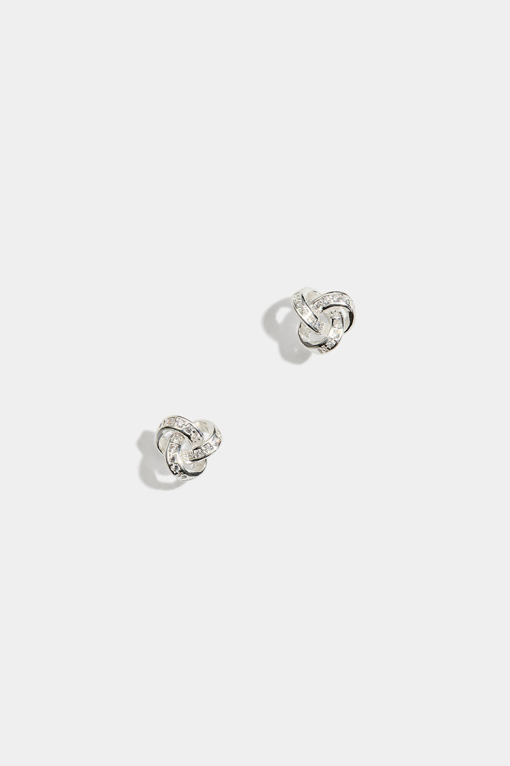 Studs i äkta silver i form av knutar, med Cubic Zirconia
