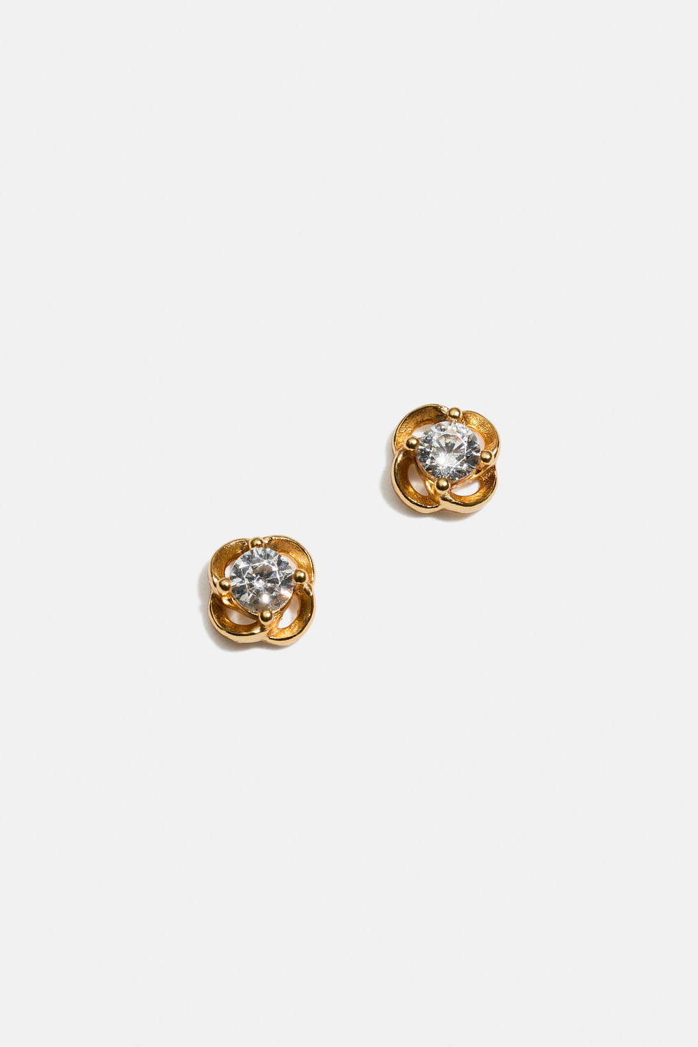 Små studs i 18k guldpläterat äkta silver med runda former och Cubic Zirconia