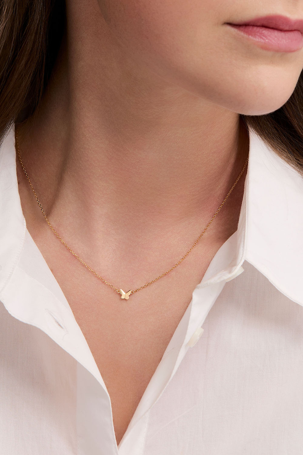 Halsband i 18k guldpläterat äkta silver med liten fjäril